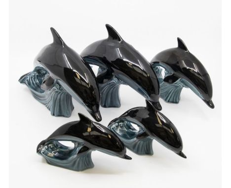 Collection of five Poole Pottery dolphins