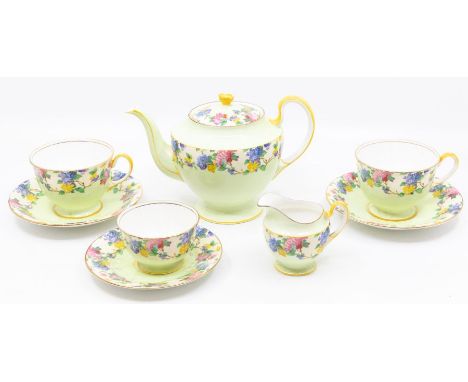 An Aynsley China B1544 part tea set to include teapot, two cups, 3 saucers, milk jug and sugar bowl, the bodies painted with 