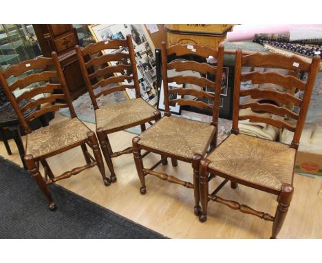 A set of four wicker seat chairs, with ladder backs