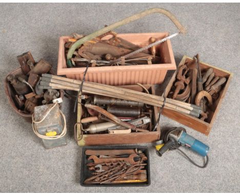 A large collection of vintage hand tools. Including wood working and mechanics, blow lamps, grease guns and bamboo drain rods