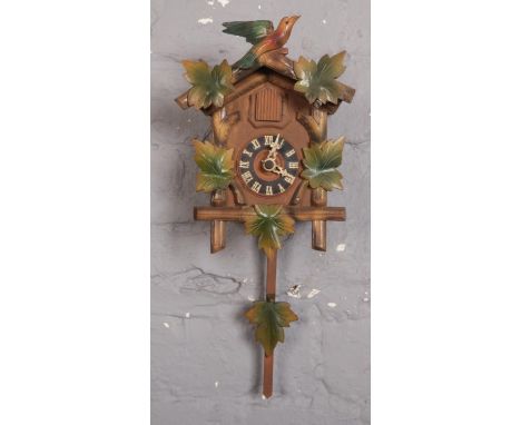 A cuckoo clock with weights  