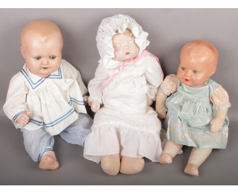 A Sugar Britches bisque head sleeping doll along with another doll marked HW JUBLIEE and one other doll.  
