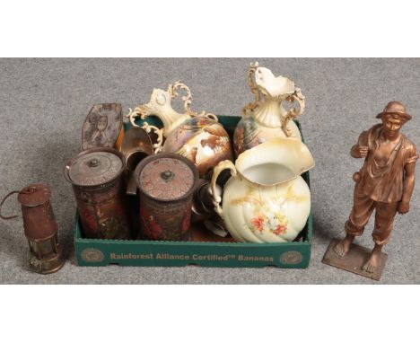 A box of ceramics and metalwares including an Eccles miners lamp, Edwardian biscuit tins and a painted spelter figure etc.  