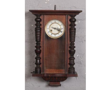 An early 20th century Vienna wall clock with two train springer movement.  No pendulum. Some mouldings lacking.