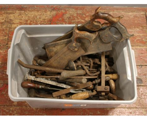 A box of hand tools to include saws, screwdrivers etc.  