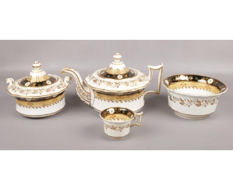 A Ridgeway part tea service.  Decorated with black and putty bands, gilded with trailing leaves and enamelled with flowers. P