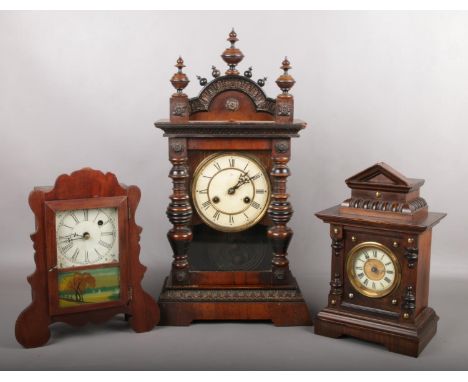 A Junghans mantel clock in simulated rosewood case striking on a gong along with two American mantel clocks. Junghans 52.5cm.