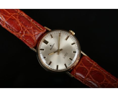 A 9ct gold cased gentleman's Buren manual wristwatch. With satin dial, baton markers and having centre seconds, 31mm wide.  A