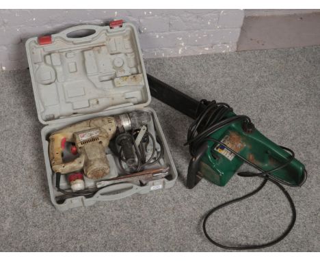 A Parkside chainsaw along with a cased Power drill.  