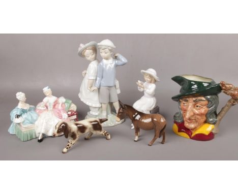 A collection of ceramic figures and animals. Lladro boy and girl, Royal Doulton the Love Letter, Beswick donkey and Royal Dou