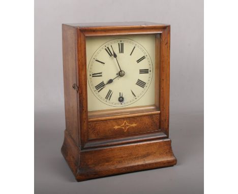 A 19th century walnut cased mantel clock with painted square dial. Housing an 8 day movement by Winterhalder &amp; Hofmeier, 