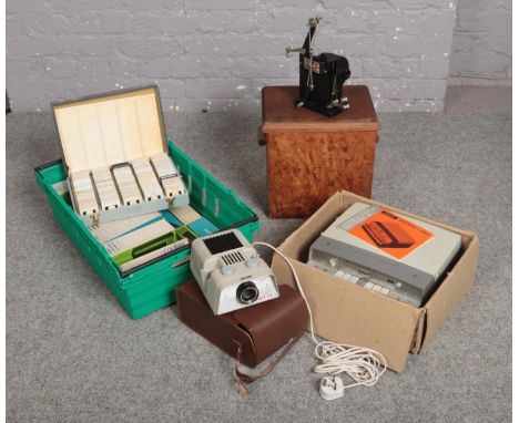 A boxed Uher Universal 5000 reel to reel tape player along with a Pathescope Ace projector, a Noris 150-A slide projector and