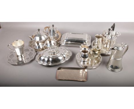 A collection of silverplate to include 4 piece tea service, 3 trays, coffee pots, plate warmer, etc.  