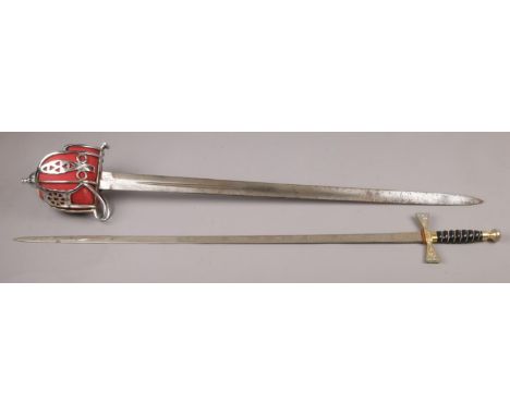 A Scottish basket hilted sword stamped Mole, Birmingham and with broad arrow mark. Along with a Wilkinson Sword court sword w