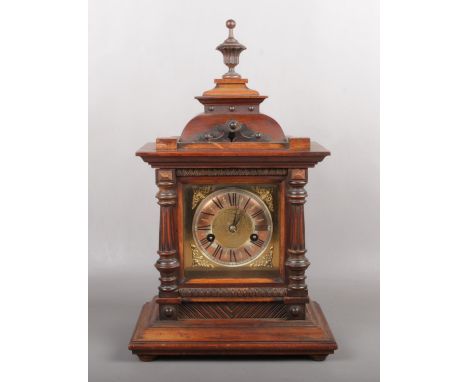 A German 14 day strike HAC mantel clock on walnut case with square brass dial, 44cm high.  