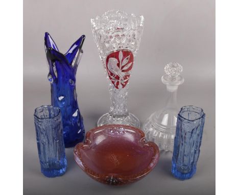 A collection of coloured glassware to include pair of bark vases, large blue glass vase, decanter, etc.  