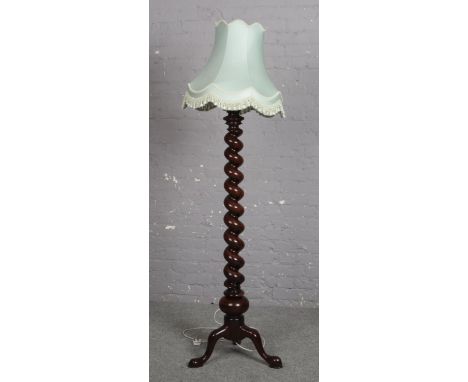 A mahogany barley twist standard lamp.  