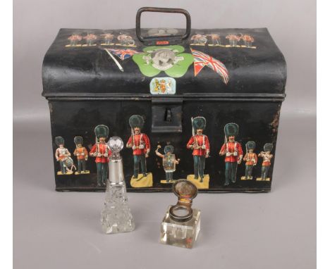 A metal trunk decorated with commemorative artwork to include glass scent bottle and ink well  