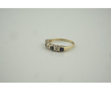 9ct Gold Sapphire and Diamond Ring, set with four small sapphires, interspersed with three small diamonds, stamped 375, overa