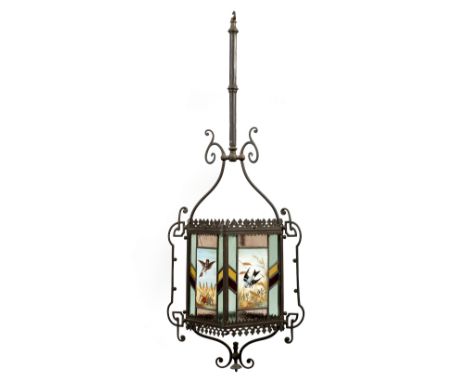 An Aesthetic period hanging lantern, the wrought iron frame with floral border and four leaded stained glass panels with cent