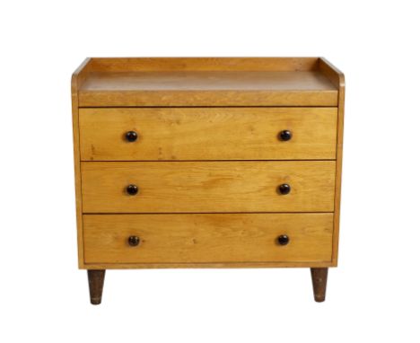 Gordon Russell, a mid 20th Century light oak chest of drawers, with three-quarter galleried top, the three long drawers with 