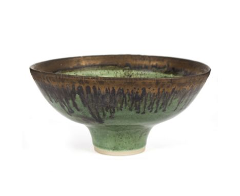 Dame Lucie Rie (Austrian/British 1902-1995), a stoneware footed bowl with an emerald green glaze and bronzed manganese drip r