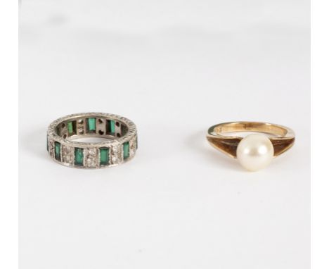 A cultured pearl ring set in 9ct yellow gold, size L and a paste set eternity ring in 9ct gold, size K