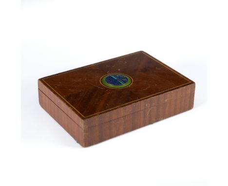 A wooden cigarette box, the quarter veneered hinged lid with applied circular enamel motif WHS, the interior with engraved pl