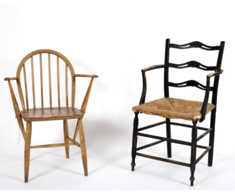 An Arts and Crafts style ebonised ladder back chair and an Ercol ash and elm Windsor chair