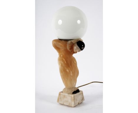 An Art Deco style lamp styled in alabaster as a pierrot balancing a globe on his back, approximately 57cm high overall  