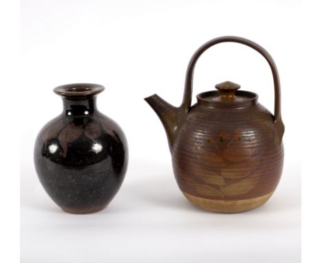 David Lloyd-Jones (British 1928-1994), a stoneware teapot of ribbed circular form painted foliate designs, with overhead hand