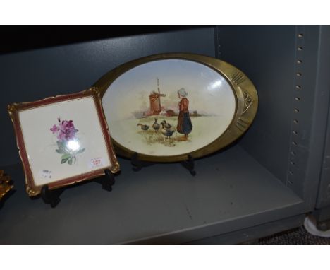 An early 20th century tray with oval brass surround and printed tile depicting a Dutch girl feeding geese, with a similar han