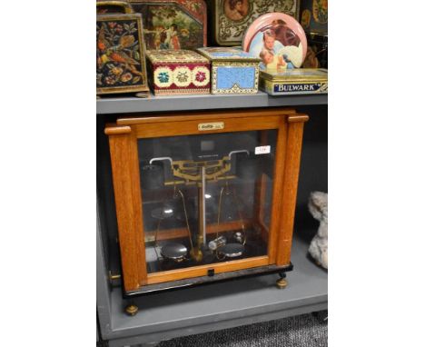 A cased set of Oertling laboratory scales