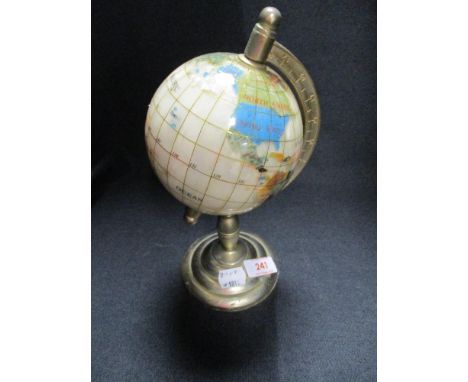 A  desk top globe of small proportions.