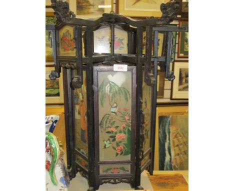 A 20th century Chinese lantern having carved wood frame with hand painted glass panels of geisha in house with foliage and wi
