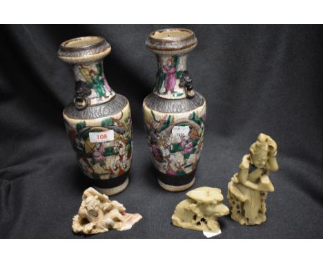 A pair of 20th century Chinese crackle glaze vase having typical brown seal mark to base with decorations of men on horse bac