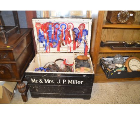 A painted wooden trunk, named to Broombeck Herefords containing various horse tack and ribbons etc.