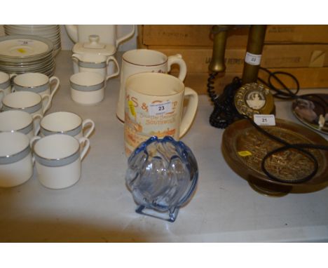 An Adnams advertising tankard together with another depicting The Butt & Oyster Pin Mill, Suffolk; and a small blue glass vas