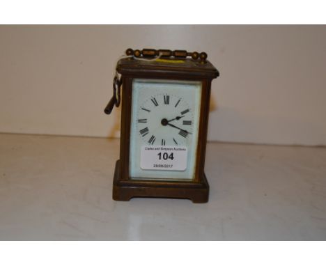 A brass cased carriage clock with key