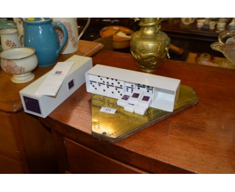 A brass cribbage board; and a Silk Cut cribbage board 