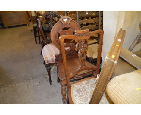 A Victorian mahogany hall chair; two dining chairs; and a stick back chair 