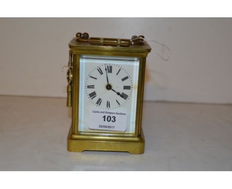A brass cased carriage clock with key