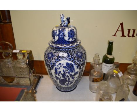 A large Delft blue and white pottery vase and cover 