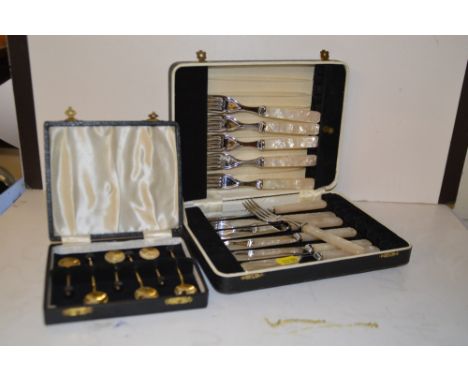 A set of six silver gilt and enamel coffee bean spoons; and a cased set of silver plated fish knives and forks 