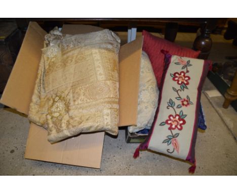 A box of cushions and a box of curtains