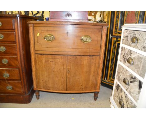 A George III mahogany and inlaid commode `