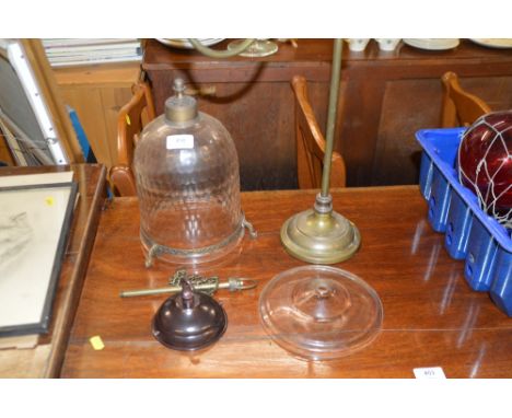 A brass desk light base; and a glass hanging lantern
