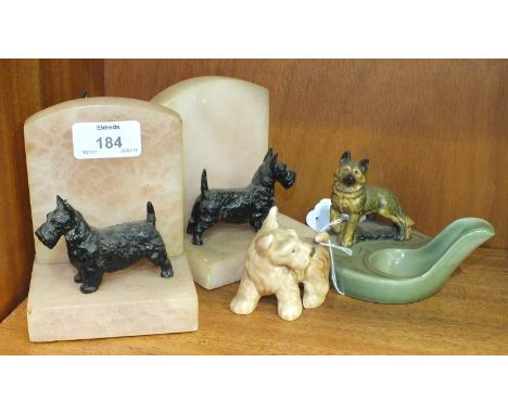 A pair of Art Deco alabaster and black painted spelter Scottie dog-mounted book ends, 12cm high, 9.5cm wide, a Wade ceramic A
