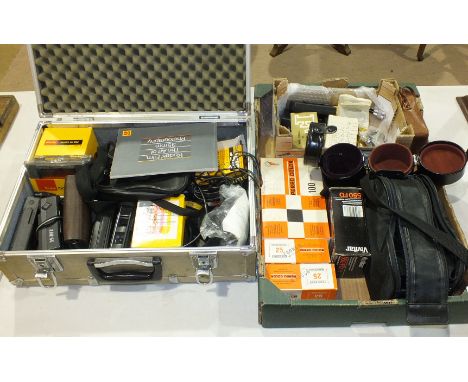 A collection of photographic equipment, including tripods, Metz lighting equipment, Perspex light box, camcorders and Kodak c