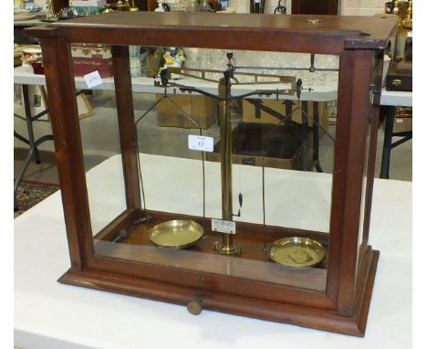 A set of Becker's Sons, Rotterdam, brass laboratory scales in glazed mahogany case, 43cm high, 52cm wide, 26cm deep.